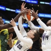 Golden State Valkyries guard Kate Martin battles Seattle Storm forward Ezi Magbegor during a WNBA game in Seattle. The Valkyries debuted this season as the league's 13th team.