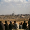 Palestinians observe Gaza City from Nuseirat refugee camp, Oct. 10, 2025.