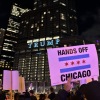 Protesters march in downtown Chicago on Oct. 8 against the deployment of National Guard troops and immigration enforcement presence.