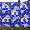 Supporters of the Cameroon People's Democratic Movement (CPDM) hold campaign fabric featuring President Paul Biya