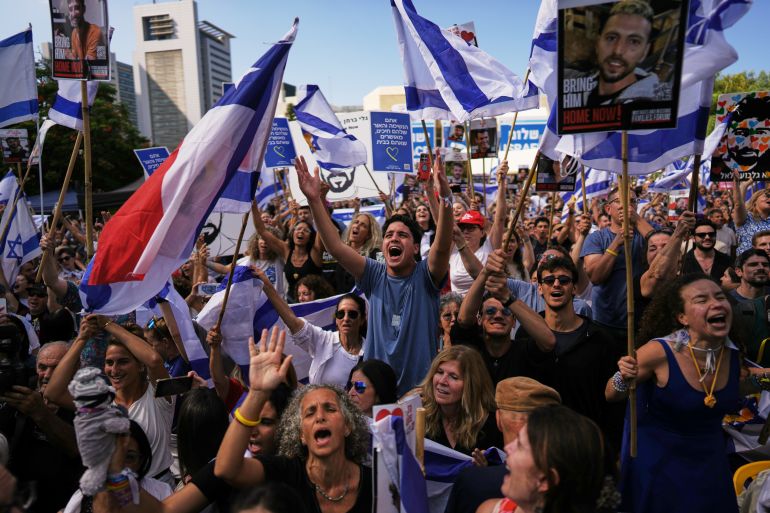 People watch live broadcast of Israeli hostages released from Gaza in Tel Aviv