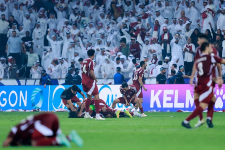 Qatar players celebrate after qualifying for the World Cup