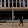 A pedestrian passes by the U.S. Department of Education building in Washington, DC.