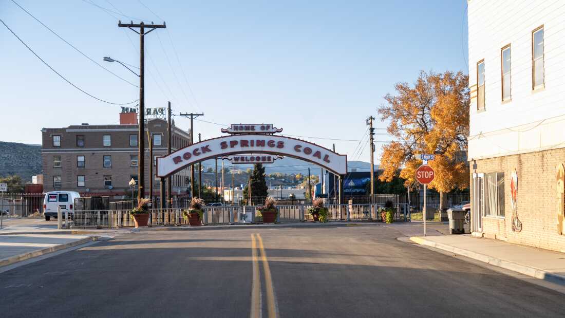 Empty street leading to Rock Springs Coal sign