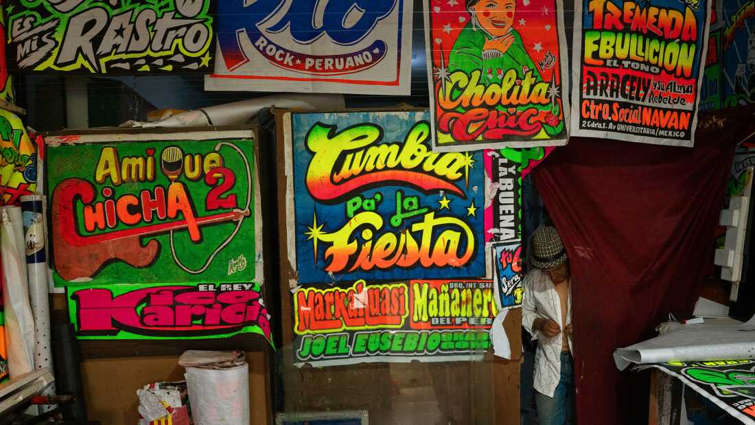 Pedro Tolomeo Rojas, aka Monky, enters his studio in Lima on October 21, 2025. Monky pioneered the vibrant posters promoting cumbia concerts, now recognized as chicha art.