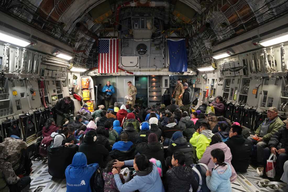 Kipnuk residents evacuated aboard a C-17 military transport plane on Oct. 16, 2025, after severe typhoon damage.
