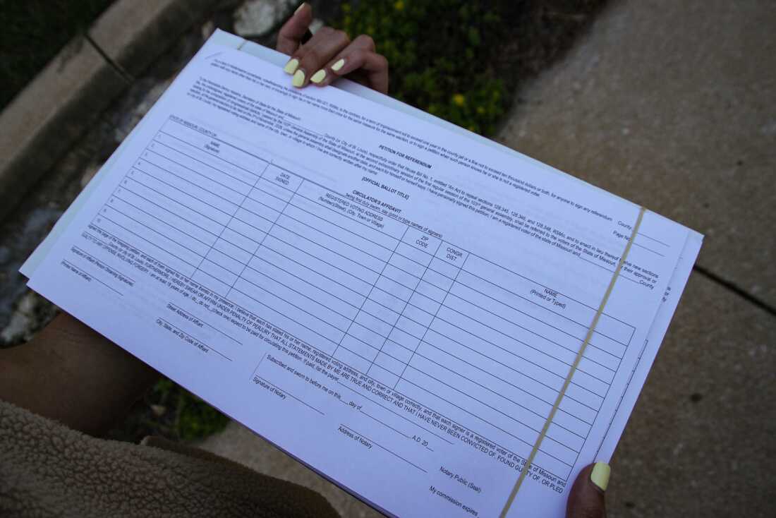 People Not Politicians Missouri collects signatures to challenge the new congressional map; signers leave the district column blank due to confusion over new boundaries.