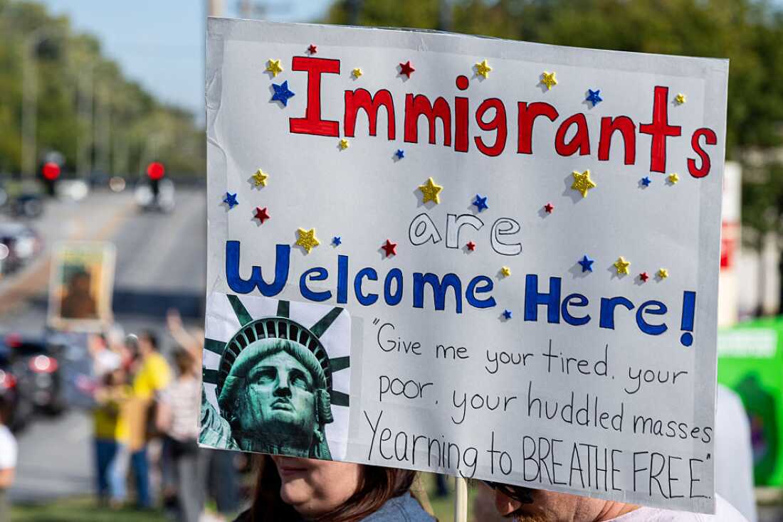 Protesters rally during the 'No Kings' national day of protest in Kansas City, Mo. on Oct. 18, 2025.