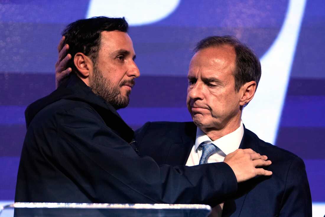 Jorge 'Tuto' Quiroga embraces running mate Juan Pablo Velasco after trailing in Bolivia's presidential runoff