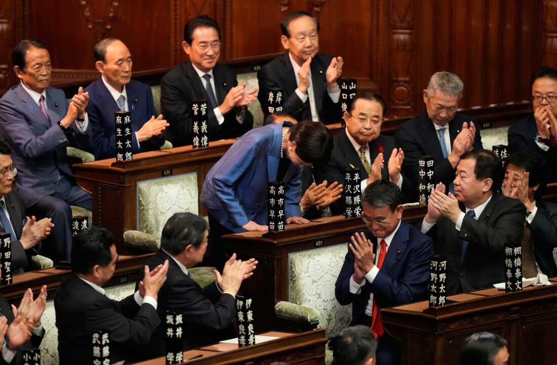 Sanae Takaichi bows after being elected Japan's prime minister during a parliamentary session in Tokyo.