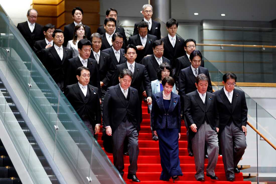 Japan's Prime Minister Sanae Takaichi with her new cabinet members in Tokyo.