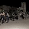 Hamas militants stand guard in Gaza City on Wednesday. Hamas police and other armed Hamas members have returned to the streets of Gaza since a ceasefire was announced last week. The plan calls for newly trained police to take over in Gaza, but it's not clear when that might happen.