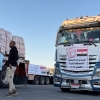 Trucks loaded with humanitarian aid on the Egyptian side of the Rafah crossing wait to cross into the Gaza Strip early on Wednesday.