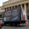 A truck displays images of Luigi Mangione on April 25, 2025, in New York City, as he appeared for arraignment on charges related to the murder of UnitedHealthcare's CEO.