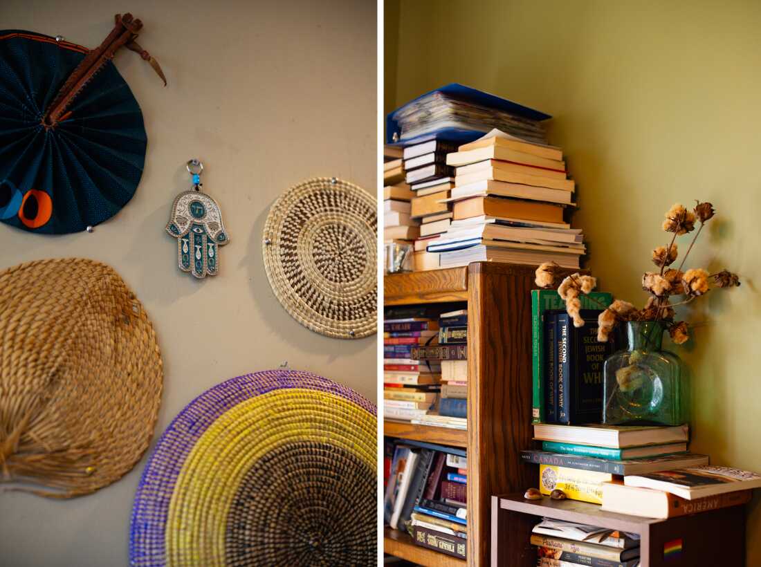 Left: A wall is adorned with fans and other artifacts from Twitty's family and his travels. Right: Branches of dried cotton are in a vase next to bookcases stacked high with books.