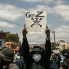 Demonstrator holding a sign during protests over water and power outages in Madagascar