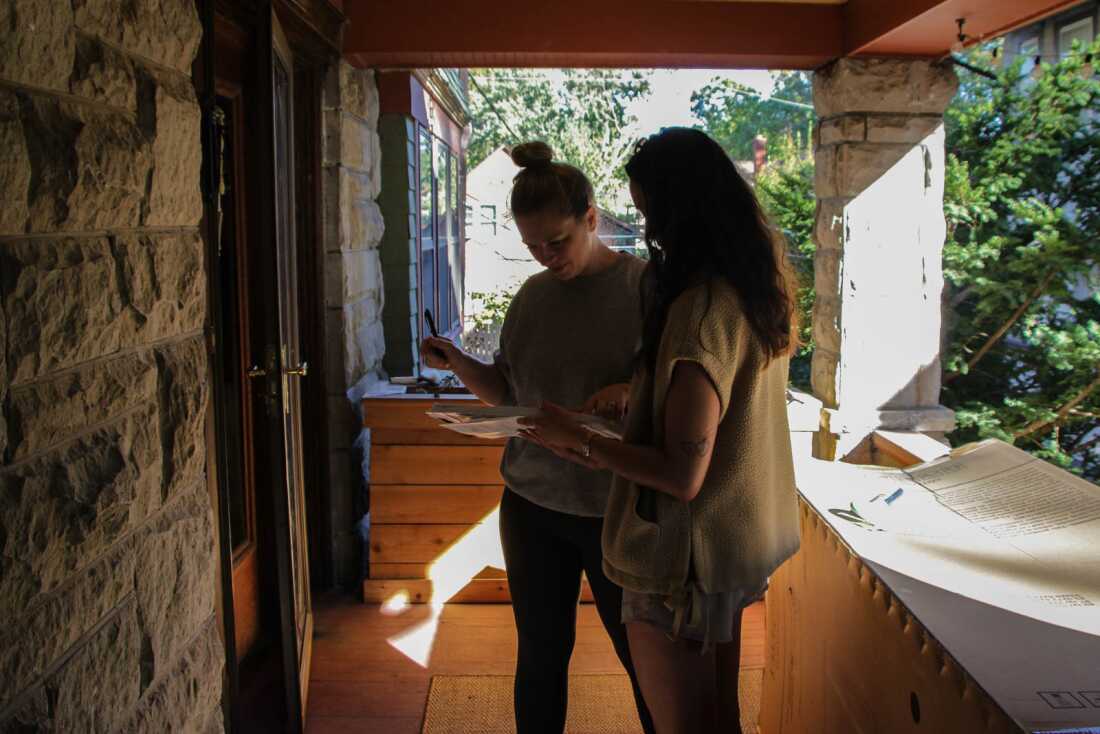 Leann Villaluz canvassing door-to-door to collect signatures for a petition challenging Missouri's new congressional map.