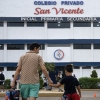 Parents dropping off children at San Vicente School, a private institution targeted by extortion in Lima, Peru