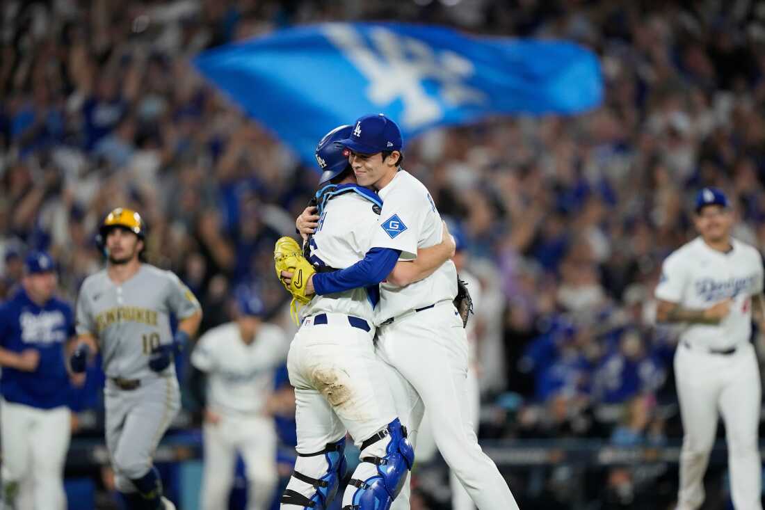 Los Angeles Dodgers pitcher Roki Sasaki and catcher Will Smith celebrate their victory over the Milwaukee Brewers in Game 4 of the National League Championship Series, Oct. 17, 2025, Los Angeles.