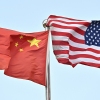 Chinese and U.S. flags outside a tech company in Beijing, April 17